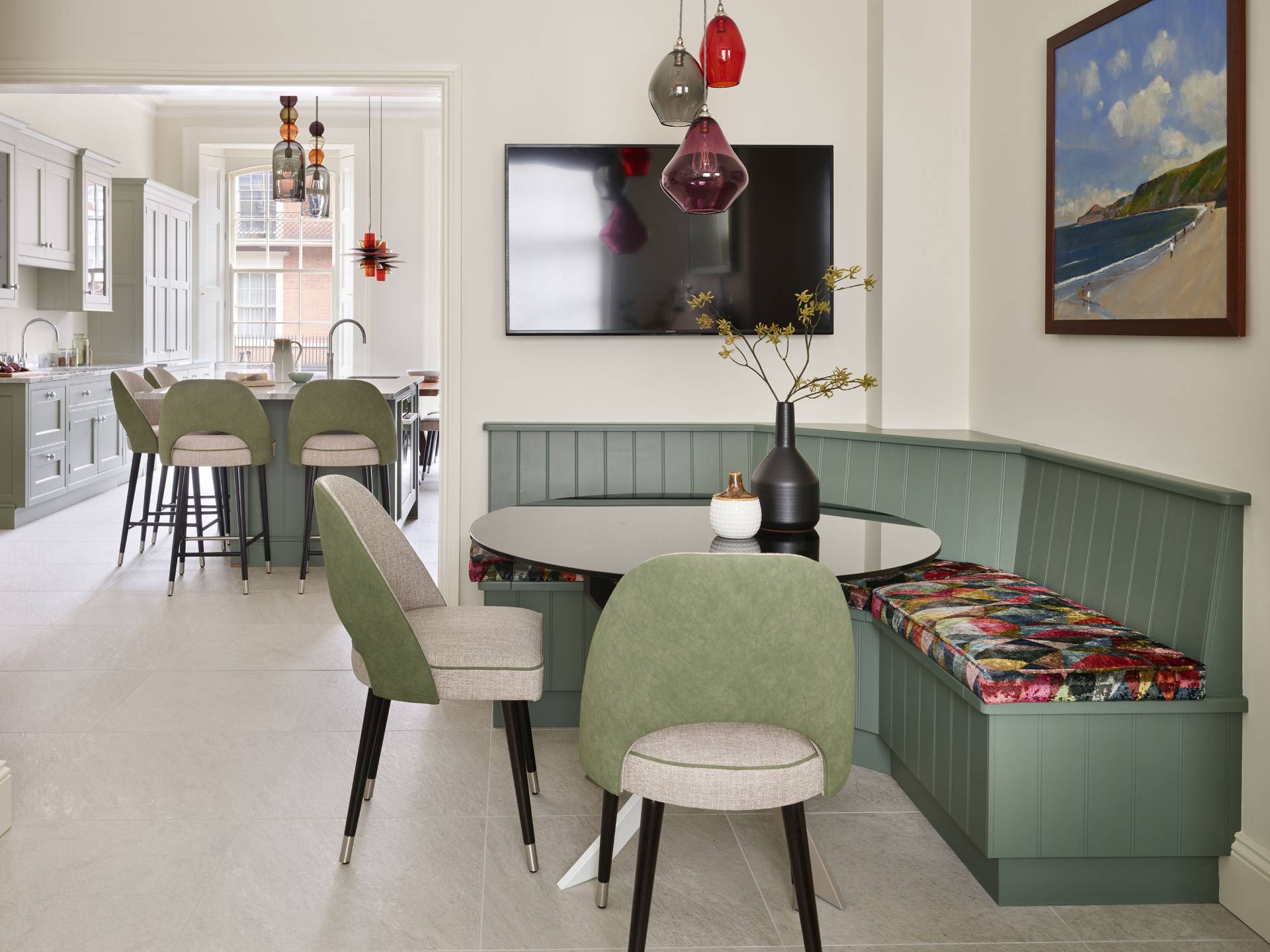 green chairs and booth with shiny table 