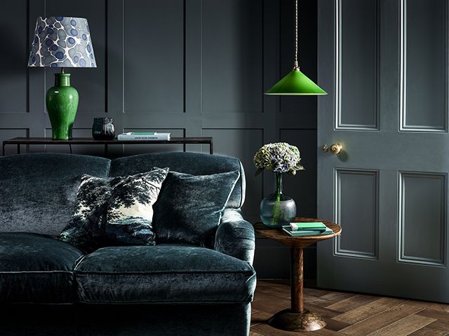 living room with pooky light and tonal green/blue scheme