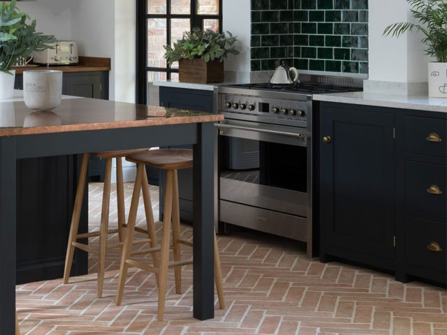 terracotta kitchen tiles laid in herringbone pattern