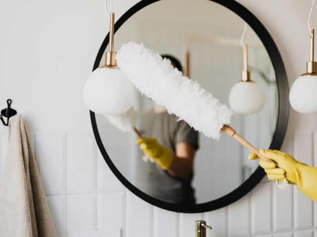 Dusting a modern bathroom